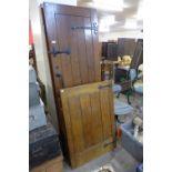 A pair of oak doors and matching stable doors