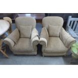 A pair of upholstered sand fabric armchairs