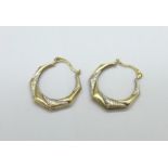 A pair of 9ct gold earrings, 0.8g