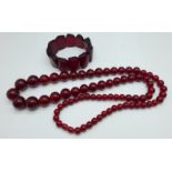 A string of cherry beads and a bracelet