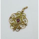A 9ct gold, garnet and seed pearl pendant, one seed pearl missing, 2.7g