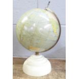 A Geographia terrestrial globe on a Bakelite base, bottom holding nut missing