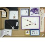 A collection of silver, amethyst and purple stone jewellery