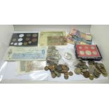 A tin of coins, bank notes and cheques