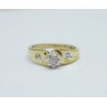 A 9ct gold and diamond ring with diamond shoulders, 2.1g, O