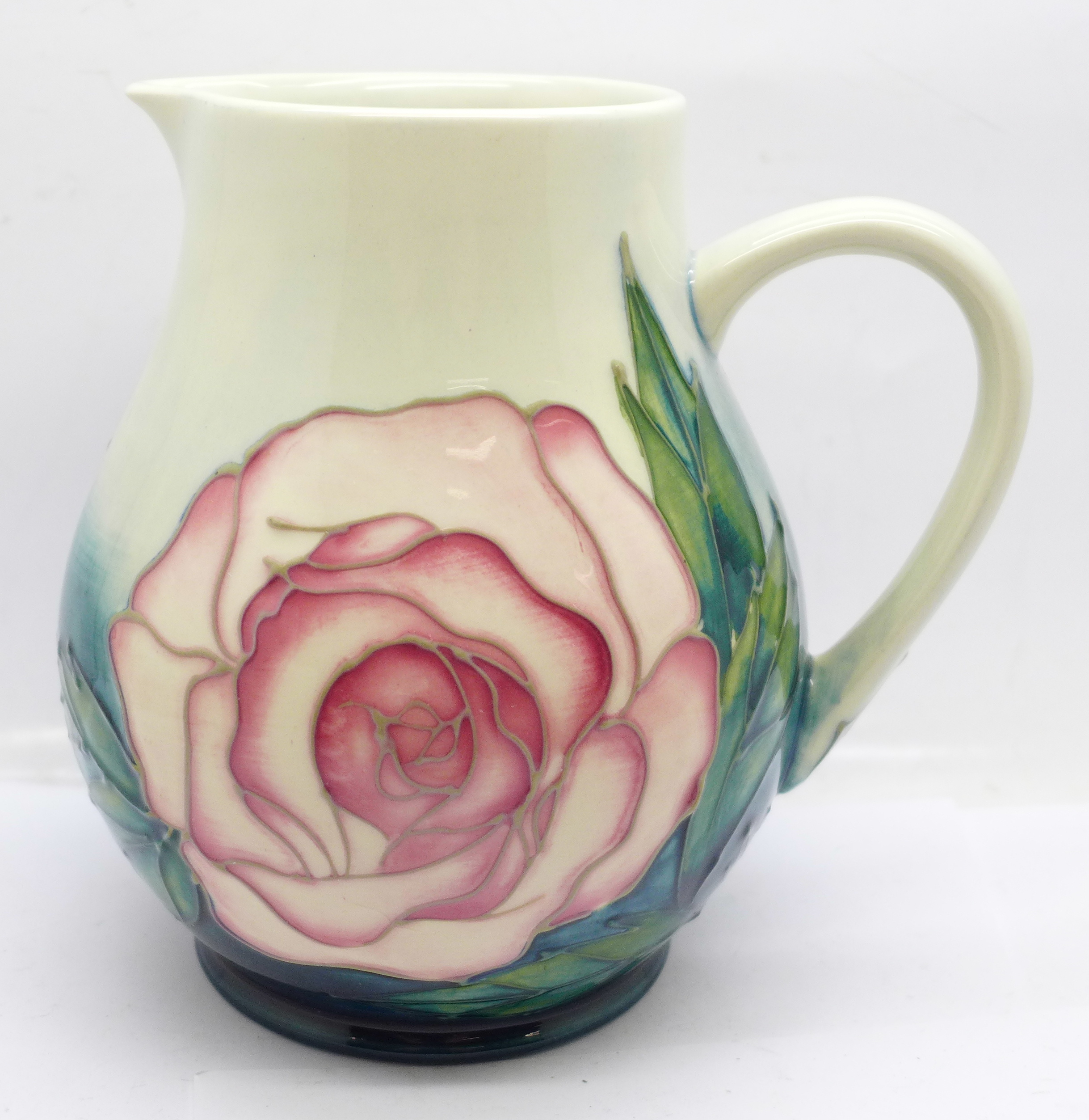 A Moorcroft Collectors Club rose jug, designed by Sally Tuffin, 14.5cm