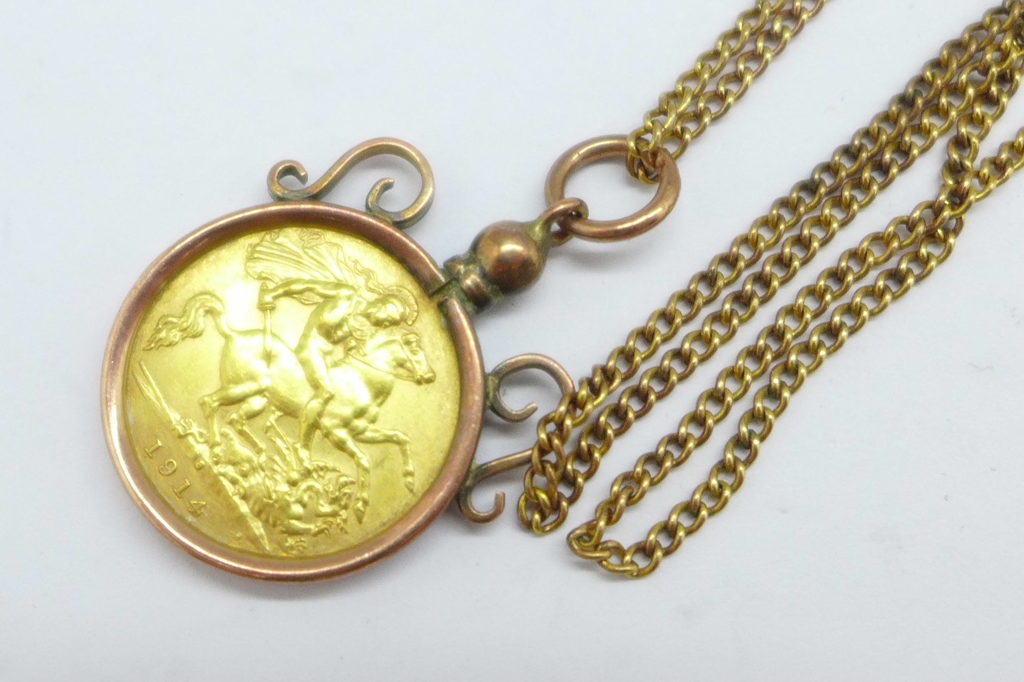 A 1914 half sovereign in a 9ct gold mount, total weight 8.8g - Image 2 of 3