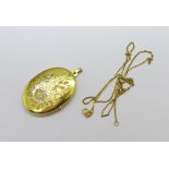 A 9ct gold locket and chain, 8.1g