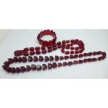 Two strings of cherry beads and a bracelet