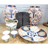 A collection of oriental china including a pair of Imari vases, two famille verte dishes, carved