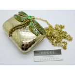 A lady?s Gucci limited edition dragonfly purse with chain