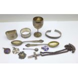 A collection of silver including two napkin rings, goblet, two silver fobs, (126g), etc.