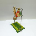 A tin-plate clockwork toy Monkey Acrobat