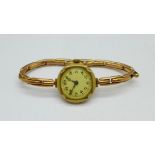 A lady's 9ct gold wristwatch on a 9ct gold expandable strap