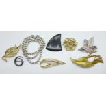 A Trifari bracelet, a Danish original penguin brooch and other signed brooches, Kramer, Sara