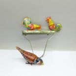 Two vintage tin-plate clockwork toys, bird and hens