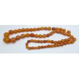 A string of butterscotch amber beads, 60.8g