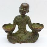 A Chinese bronze incense burner in the form of a boy holding lotus flowers, 57mm