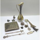 A collection of continental silver including a cigarette case, jug, rings, spoon, etc., 280g