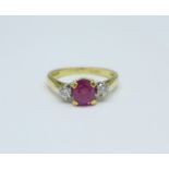 An 18ct gold, three stone ruby and diamond ring, 3.6g, M