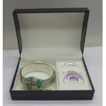 A Cosmopolitan fashion wristwatch with four coloured bezels, in original box