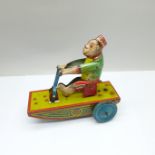 A 1960's clockwork tin-plate 'Banana Joe' toy, marked made in England