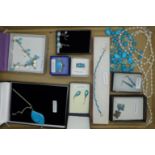 A collection of turquoise set silver jewellery