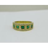 A yellow metal, emerald and diamond ring, marked 750 in the shank, 6.1g, O
