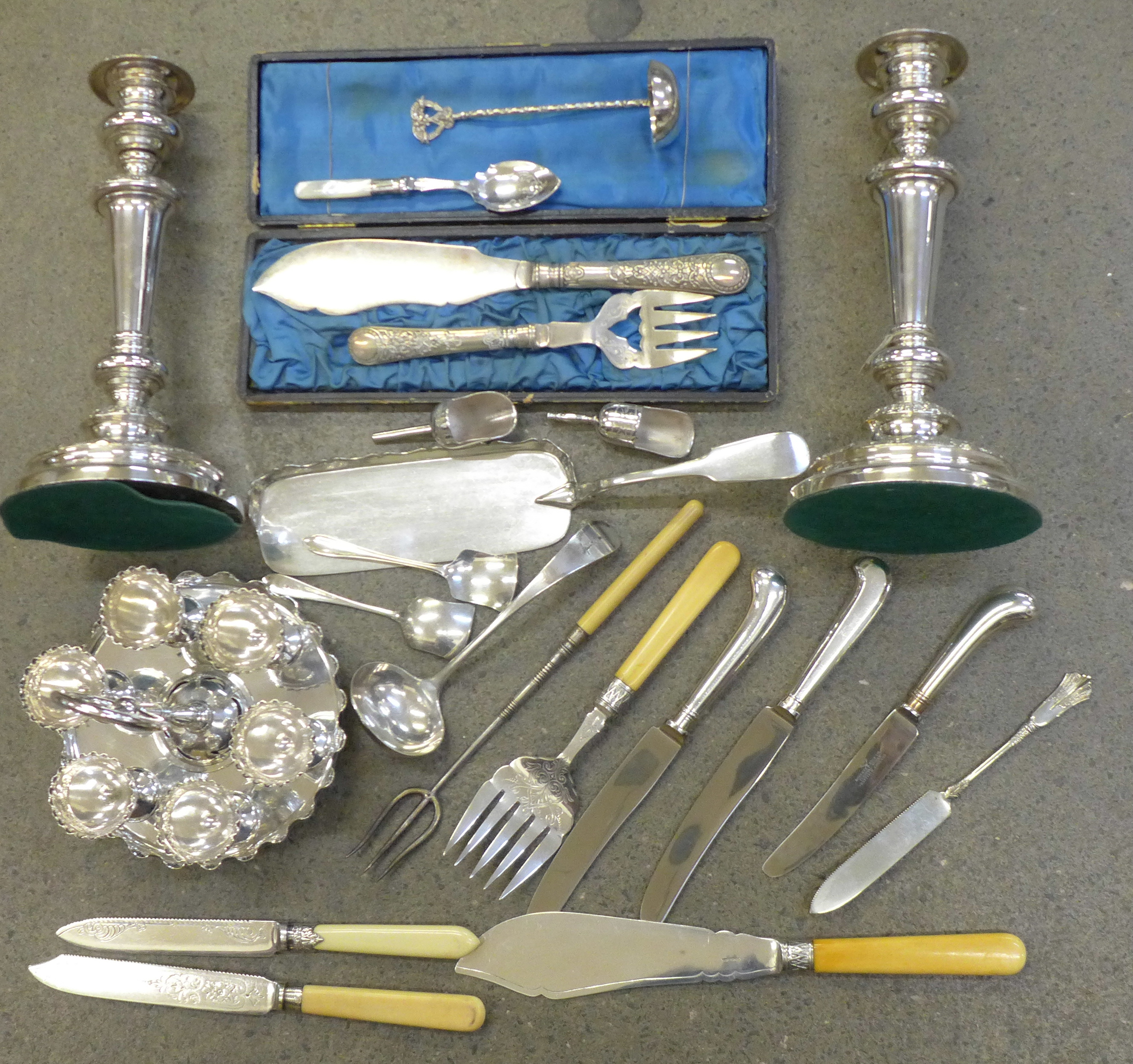 A collection of silver plate, candlesticks, an egg stand, etc.