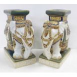 Two ceramic elephant stands