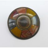 A white metal Scottish agate set brooch, (tests as silver), 44mm
