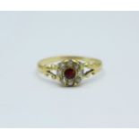 An 18ct gold old cut diamond and garnet cluster ring, 2.0g, R