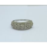 A silver and diamond set ring, W