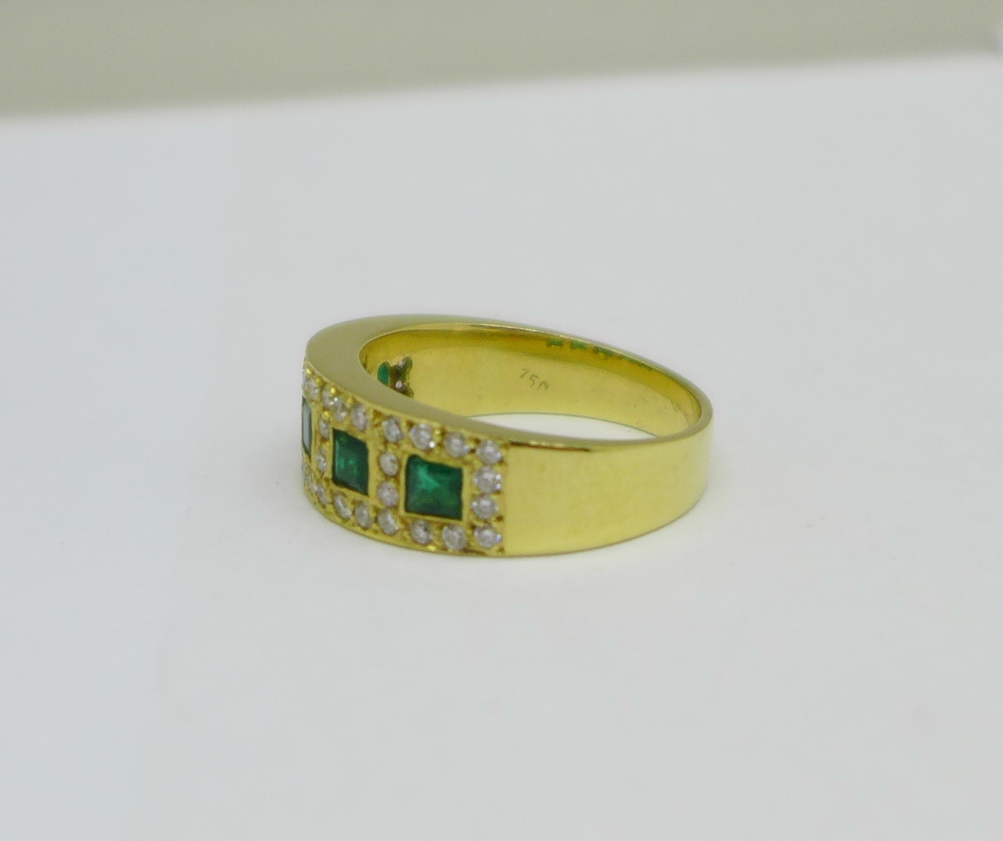A yellow metal, emerald and diamond ring, marked 750 in the shank, 6.1g, O - Image 2 of 3