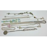 Eleven silver necklaces and one silver bracelet, 84g