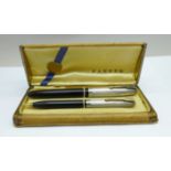 A cased Parker pen set