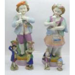 A pair of continental figures, a pair of miniature figures, one other miniature figure and a pin