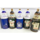 Five Bell's Old Scotch Whisky decanters in containers; three Extra Special