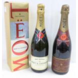 Two bottles of Moet & Chandon champagne including one 1983, Brut Imperial Rose, second bottle boxed