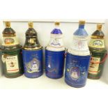 Five Bell's Old Scotch Whisky decanters in containers; two Extra Special