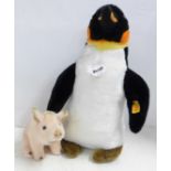 A Steiff penguin and piglet
