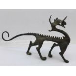 A Chinese bronze dragon brush rest, 15cm