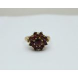 A 9ct gold and garnet ring, 2g, K