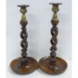 A pair of matched open twist candlesticks
