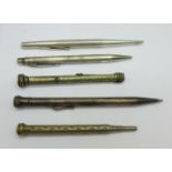 Five propelling pencils including two silver