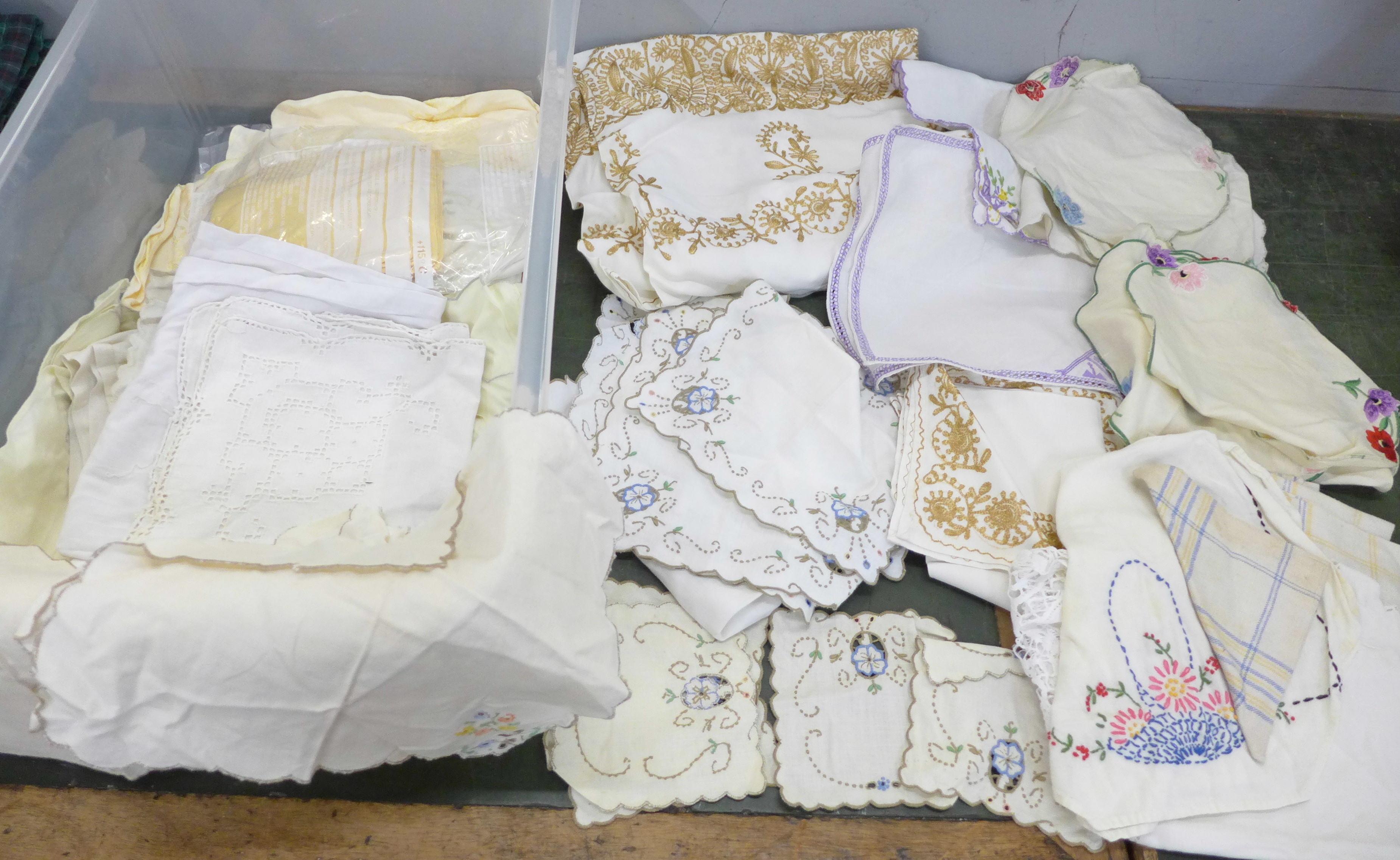 A box of embroidered linen, some in sets