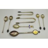 Eight silver spoons and two pairs of silver sugar bows, 118g