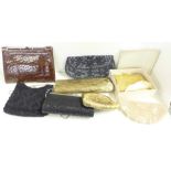 A collection of vintage handbags and purses