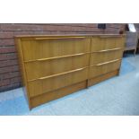 A teak chest of drawers