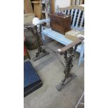 A cast and wrought iron table base